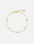 Minimalist polished gold cross link bracelet on a woman's wrist