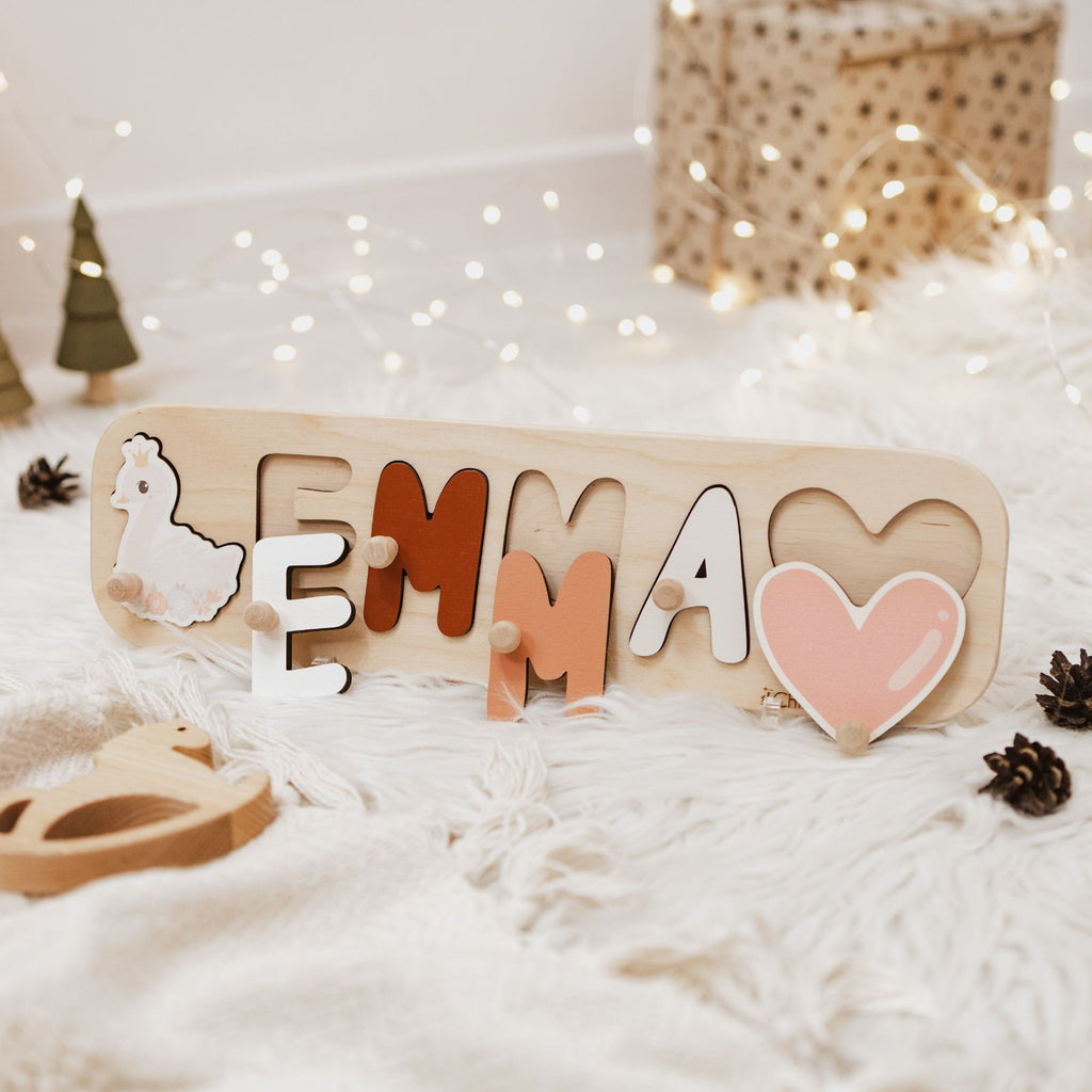 Personalized wooden name puzzle for girls featuring colorful letters on a natural wood board.