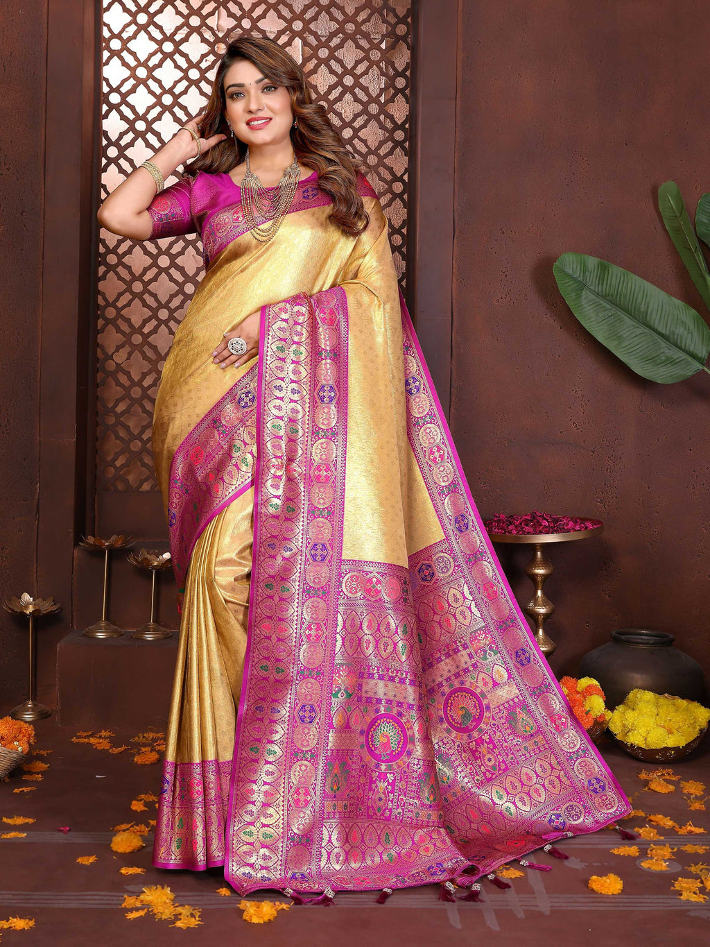 Elegant yellow tissue silk saree with intricate weaving patterns.