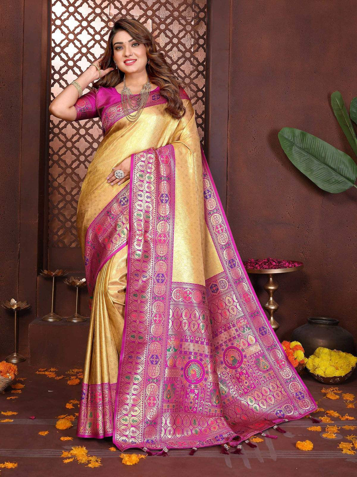 Elegant yellow tissue silk saree with intricate weaving patterns.