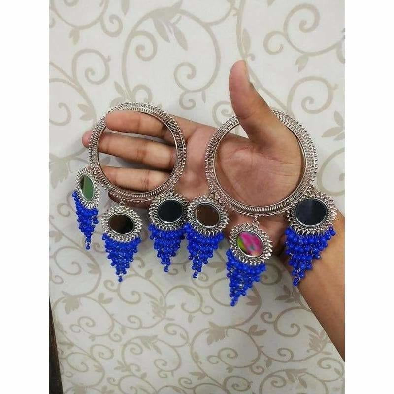 Silver-toned bangle featuring hanging blue pearls and mirror latkan details