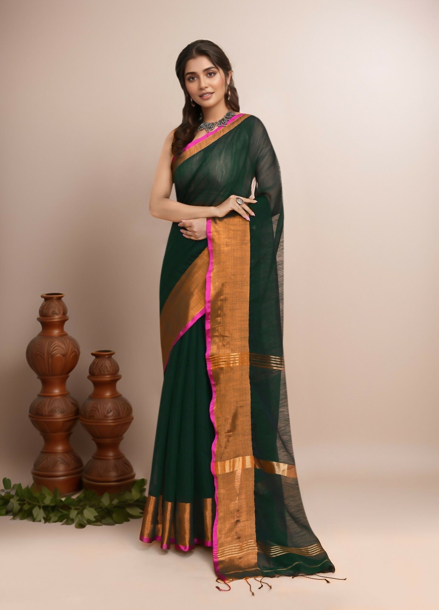 Bottle green cotton blend handloom saree with a deep, rich color and traditional weave.