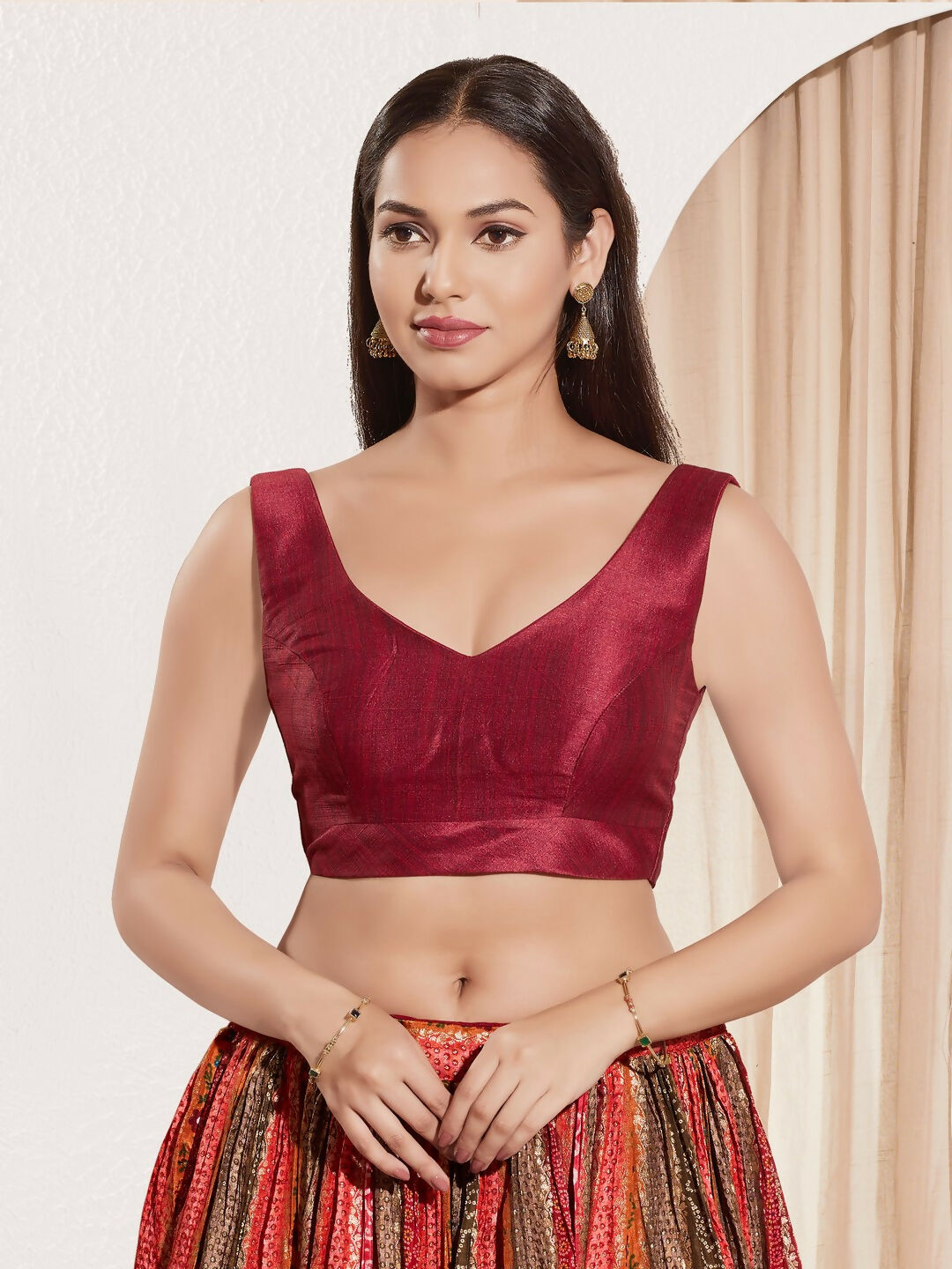 Dark maroon mulberry silk sleeveless padded blouse with a round neckline