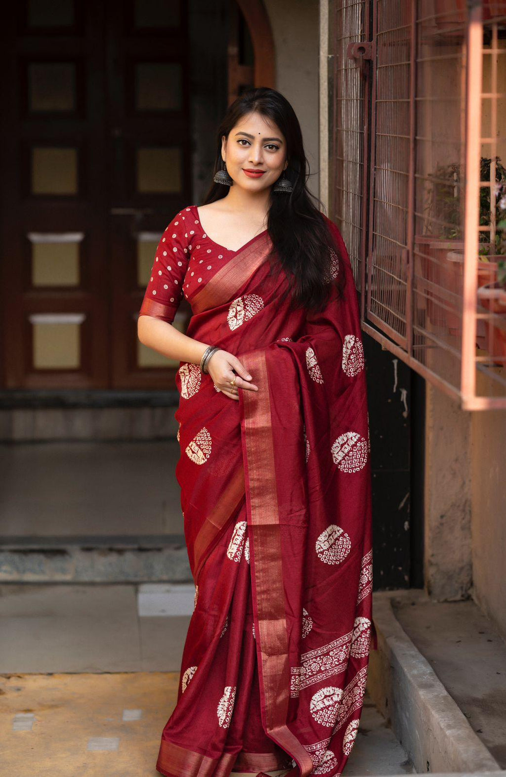 Maroon Cotton Crepe saree with batik print and zari border