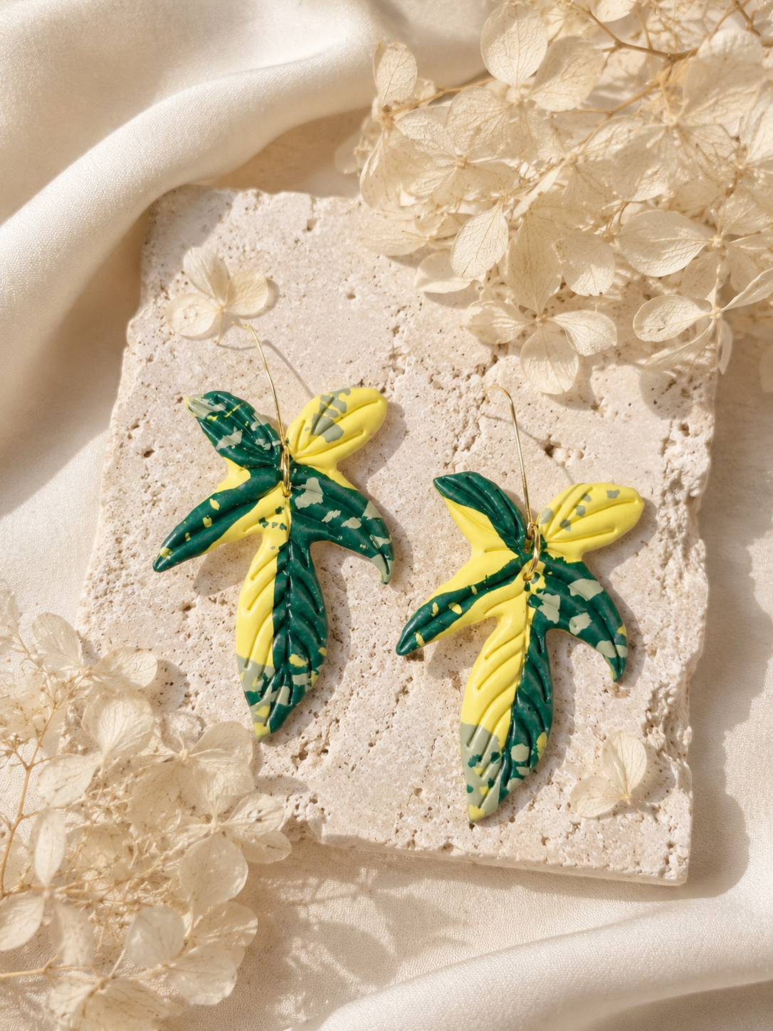 Vibrant Florida Beauty abstract polymer clay earrings in green and yellow.