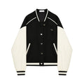 Women's black and cream gothic Harajuku varsity jacket with heart buttons and ribbed trim.