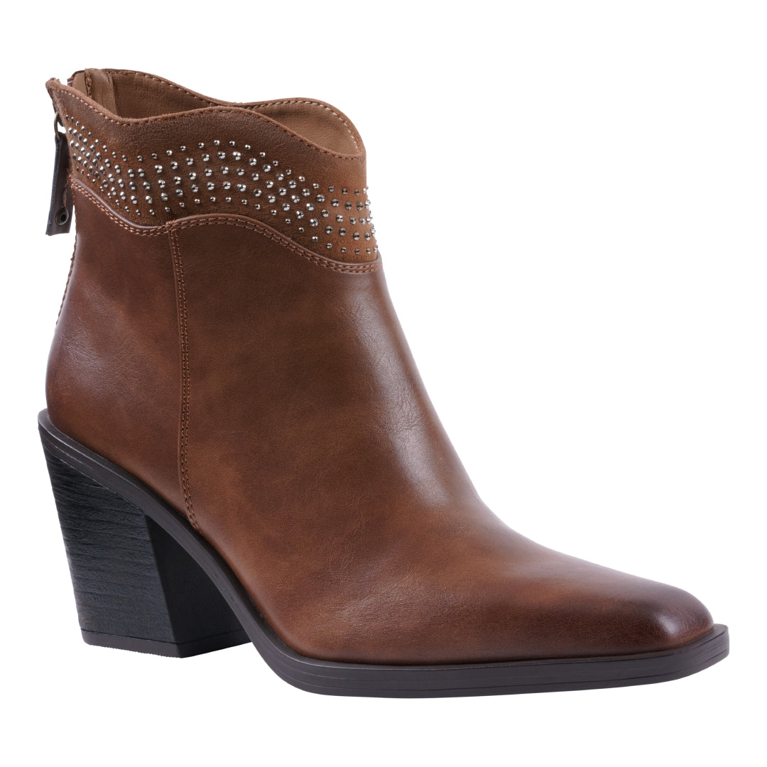 Side view of Women's Dawn Cognac ankle boot featuring a studded collar, back zipper, and black block heel.