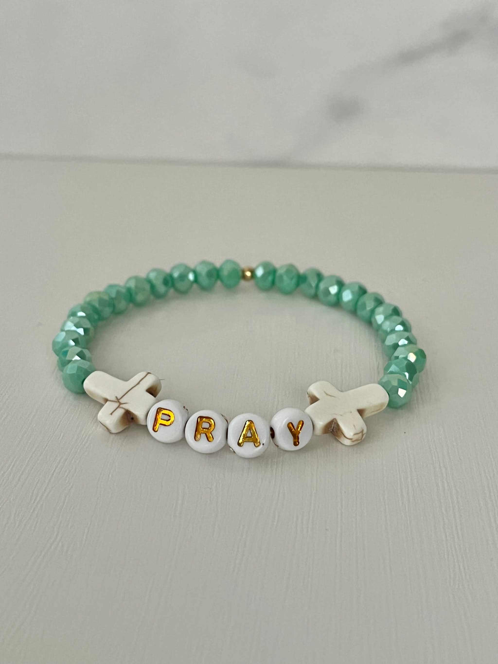 Close up of a PRAY Mint Faceted Beaded Bracelet featuring vibrant mint beads.