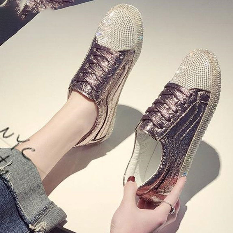 Pair of women's Golden Silver Bling Harajuku style fashion sneakers with rhinestone embellishments.