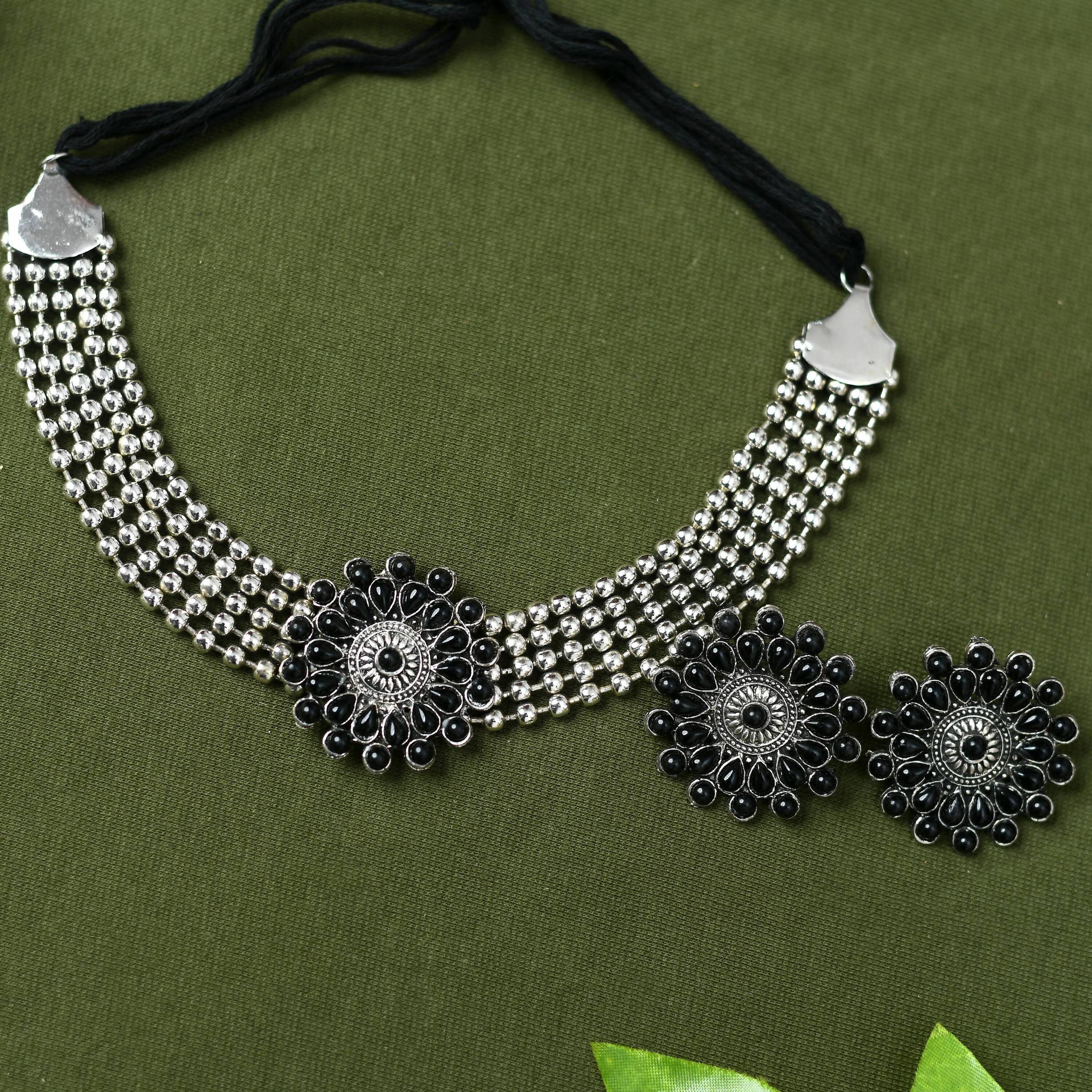 Silver-plated brass choker with Kundan stones and black design elements