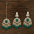 Kundan and Pearl maang tika and earring set with onyx stones in golden and green