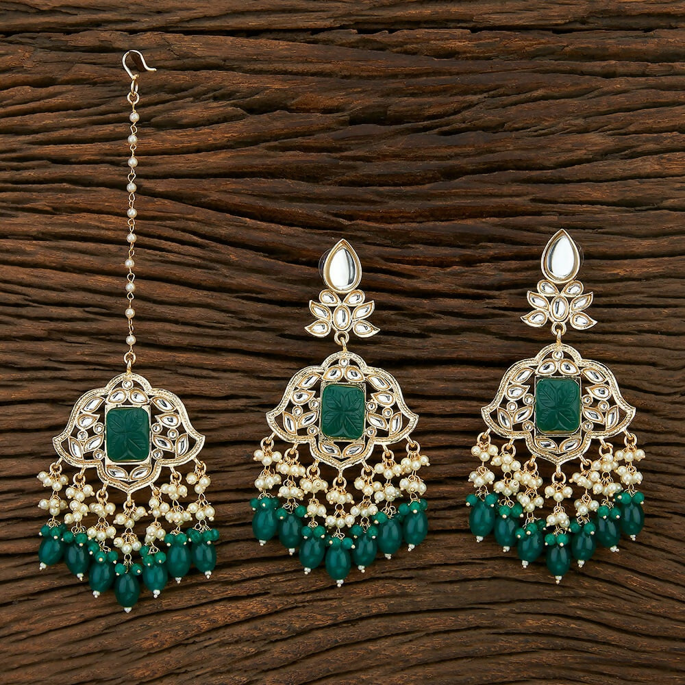Kundan and Pearl maang tika and earring set with onyx stones in golden and green