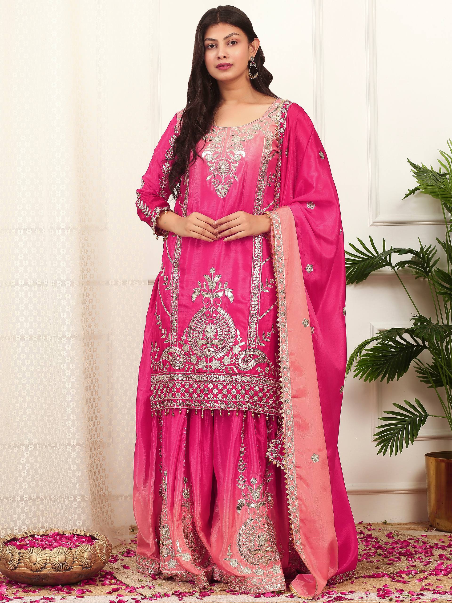 Pink shaded Chinon silk palazzo suit featuring heavy sequence embroidery and decorative hanging lace border.