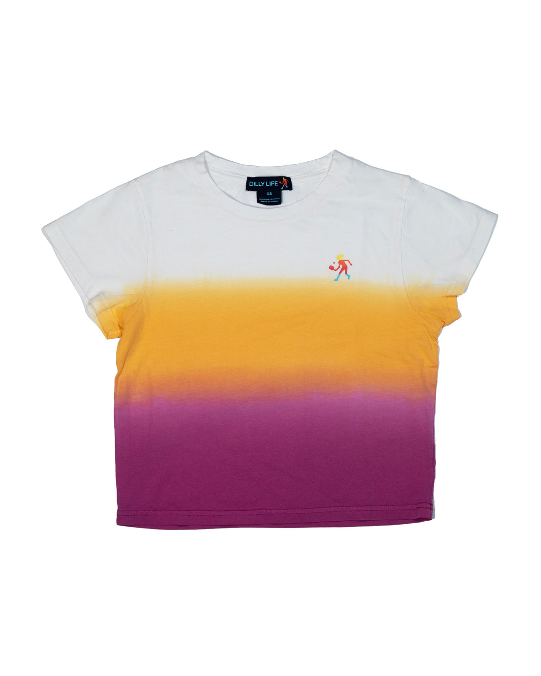 A woman wearing a white, yellow, and magenta dip dye t-shirt while sitting on a pickleball court.
