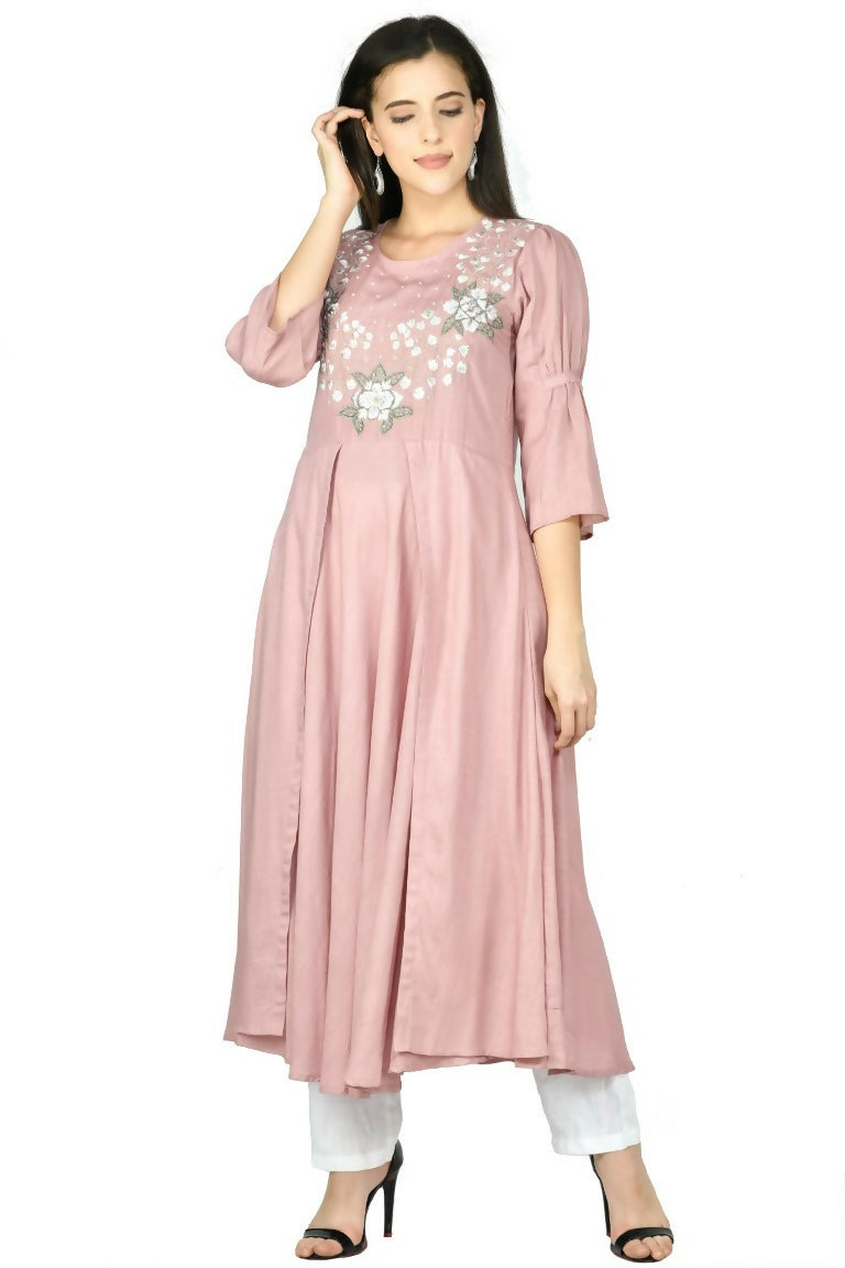 A woman wearing a Rose Gold Cotton Rayon Kurta Set, showcasing the soft fabric and traditional design.