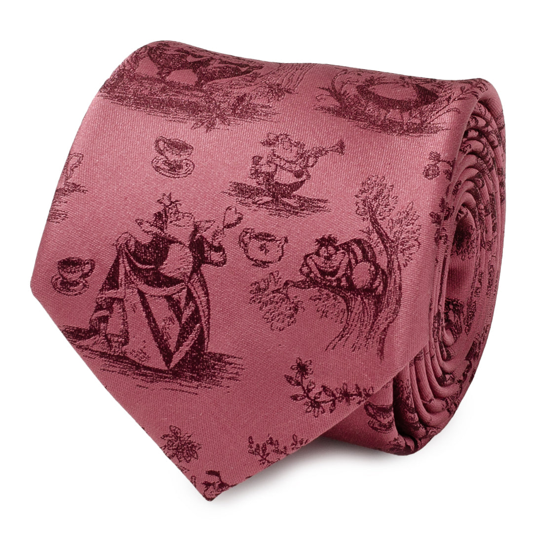 A rolled dusty red silk necktie featuring an intricate woven pattern of Alice in Wonderland characters, tea cups, and floral motifs.