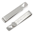 Silver tie bar featuring a cutout of a Buzz Lightyear rocket ship with the engraved text To Infinity and Beyond