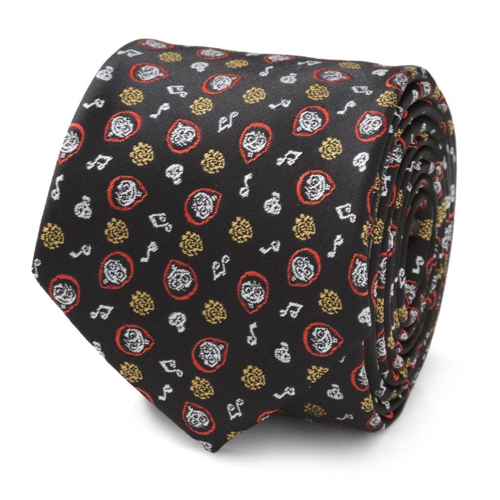 Close up of a black necktie featuring a repeating pattern of Disney Pixar Coco characters and music notes