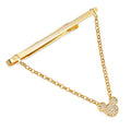 A gold-tone tie bar with an attached chain and a crystal-encrusted Mickey Mouse head icon.