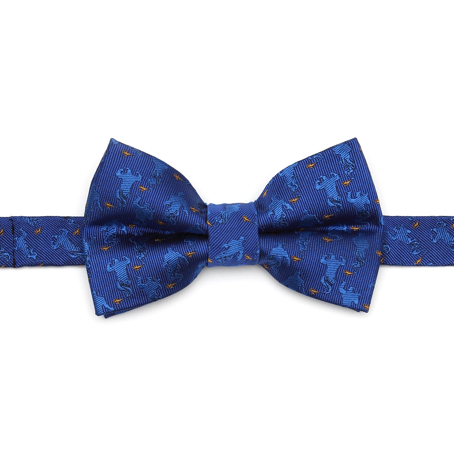 Close up of a blue bow tie with an Aladdin Genie and magic lamp pattern, displayed flat and then worn on a child in a white shirt.