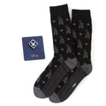Disney gift set featuring black socks with a grey Goofy pattern and a square blue Mickey Mouse enamel lapel pin.