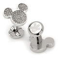 A pair of stainless steel Mickey Mouse head cufflinks with white pave crystals and glove logo on the closure.