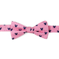 Pre-tied pink silk bow tie with navy blue Mickey Mouse icons and dots