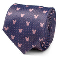 A rolled up purple silk necktie with a repeating pattern of small pink Mickey Mouse heads and dots