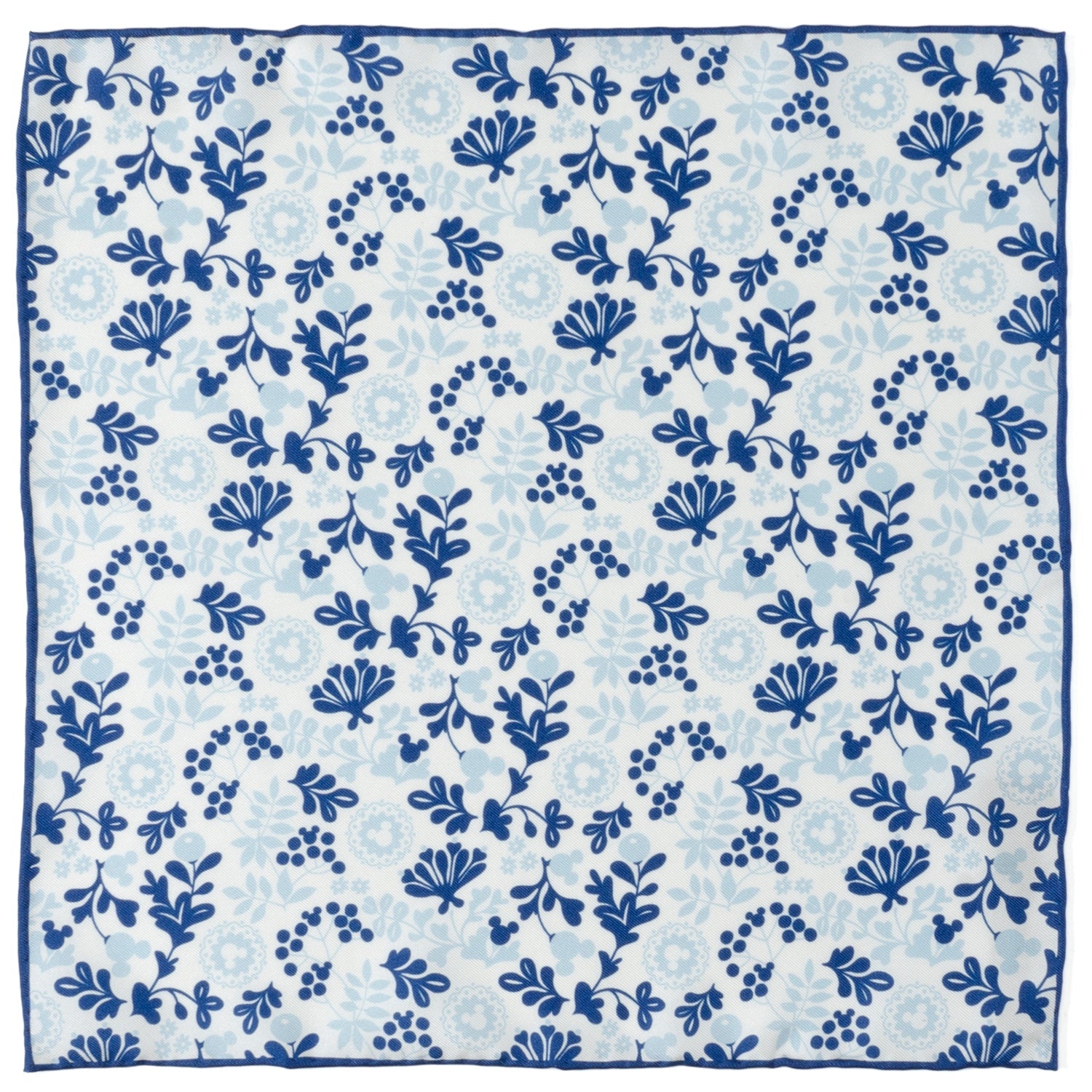 A white silk pocket square with a blue and navy floral pattern featuring hidden Mickey Mouse silhouettes.