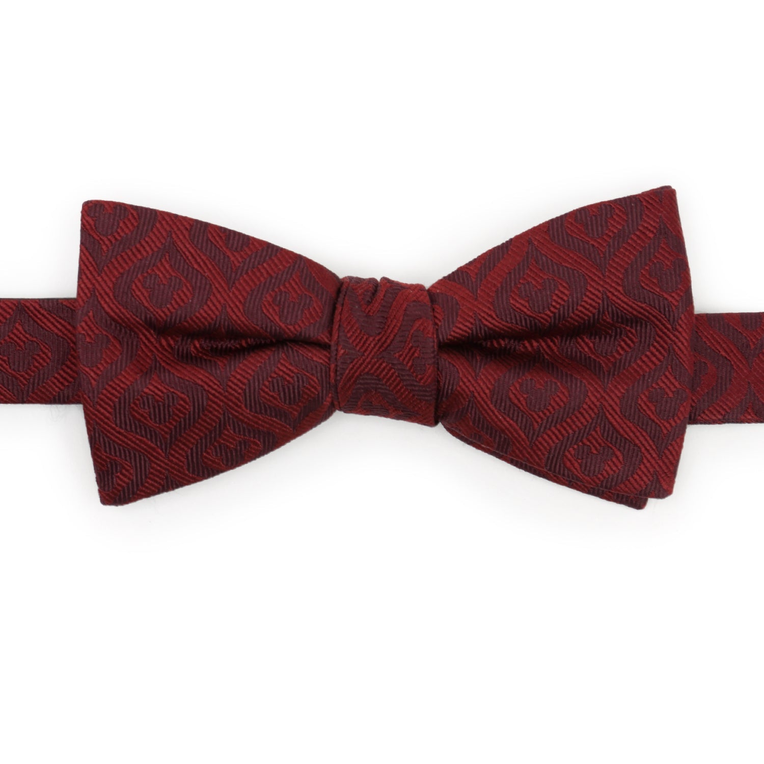 A maroon silk bow tie with a subtle repeating Mickey Mouse silhouette pattern on a white shirt background.