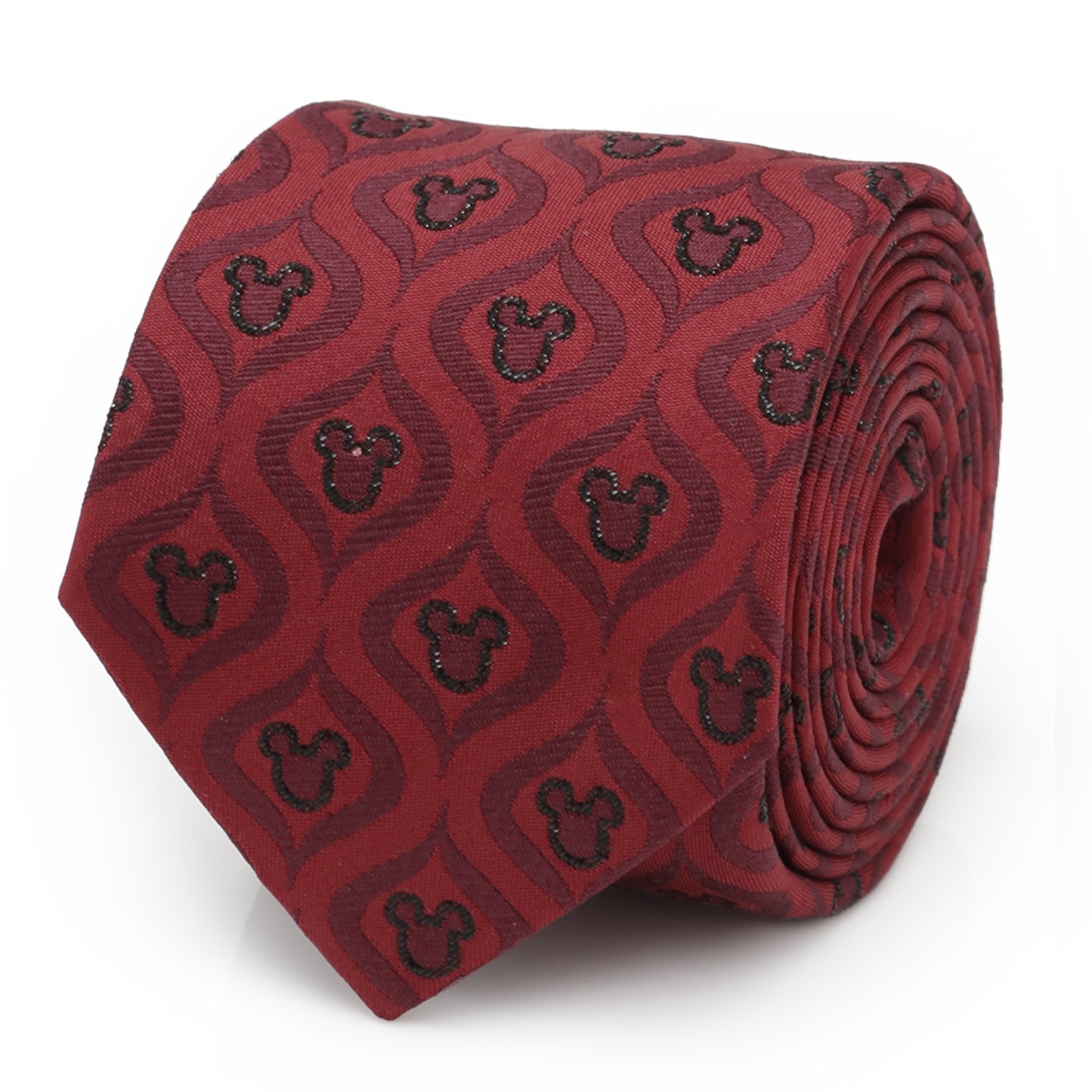 A festive red silk necktie with a black geometric pattern and Mickey Mouse icons, displayed on a suit and shirt.
