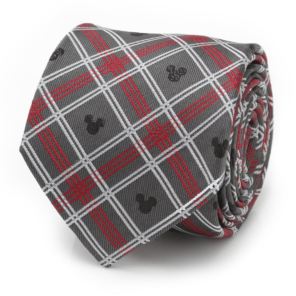 Close up of a gray, red, and white plaid silk necktie featuring small black Mickey Mouse icons, shown rolled and also on a suit mannequin.