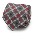 Close up of a gray, red, and white plaid silk necktie featuring small black Mickey Mouse icons, shown rolled and also on a suit mannequin.