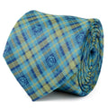 Close up of a blue and green plaid tie with small Monsters Inc. character icons, and a view of the tie styled on a mannequin with a grey suit.