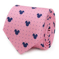 Close up rolled view of a pink silk necktie with navy blue Mickey Mouse icons and pin dot pattern