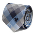 Close up of a blue plaid necktie with subtle Mickey Mouse head silhouettes pattern.