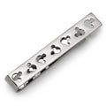 Silver tone tie bar featuring cutout Mickey Mouse silhouettes across the front, displayed on a grey necktie.