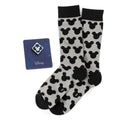 Disney Mickey Mouse gift set featuring gray and black striped socks with Mickey silhouettes and a blue Mickey Mouse enamel lapel pin.