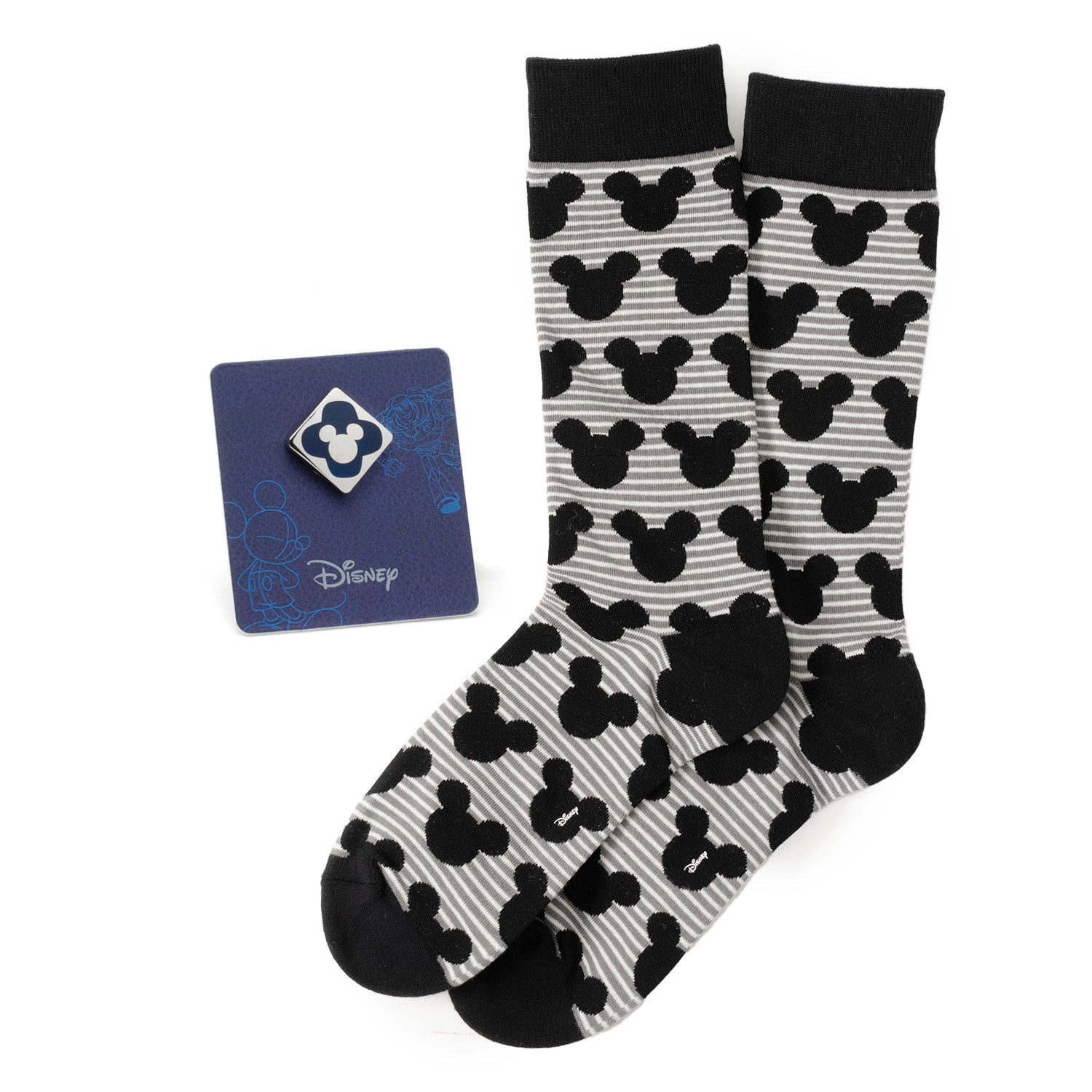 Disney Mickey Mouse gift set featuring gray and black striped socks with Mickey silhouettes and a blue Mickey Mouse enamel lapel pin.