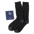 A gift set featuring black socks with a Mickey Mouse pattern and a blue Mickey Mouse enamel lapel pin.