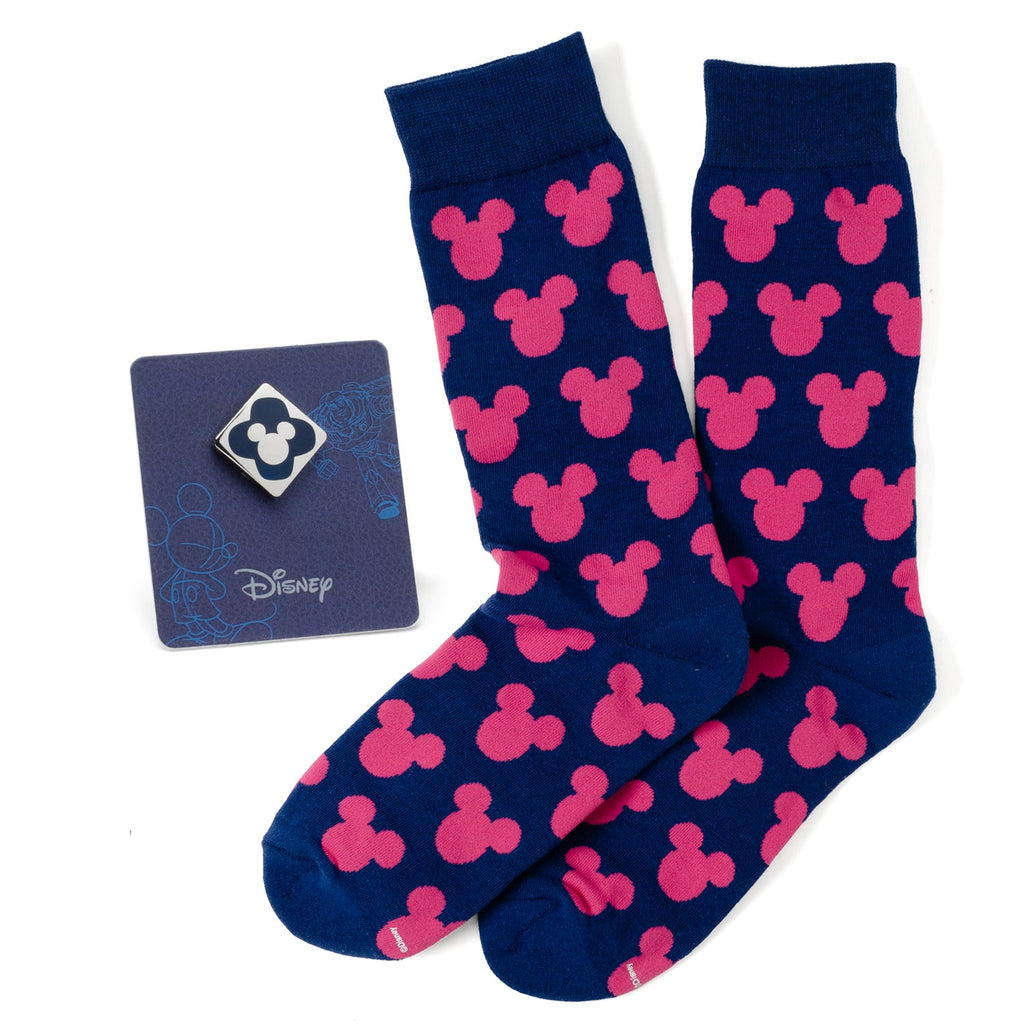 A gift set featuring blue socks with pink Mickey Mouse patterns and a matching blue Mickey Mouse enamel lapel pin.