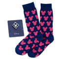 A gift set featuring blue socks with pink Mickey Mouse patterns and a matching blue Mickey Mouse enamel lapel pin.