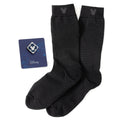 A gift set containing black striped socks with a Mickey Mouse head icon and a blue enamel Mickey Mouse lapel pin on a display card.