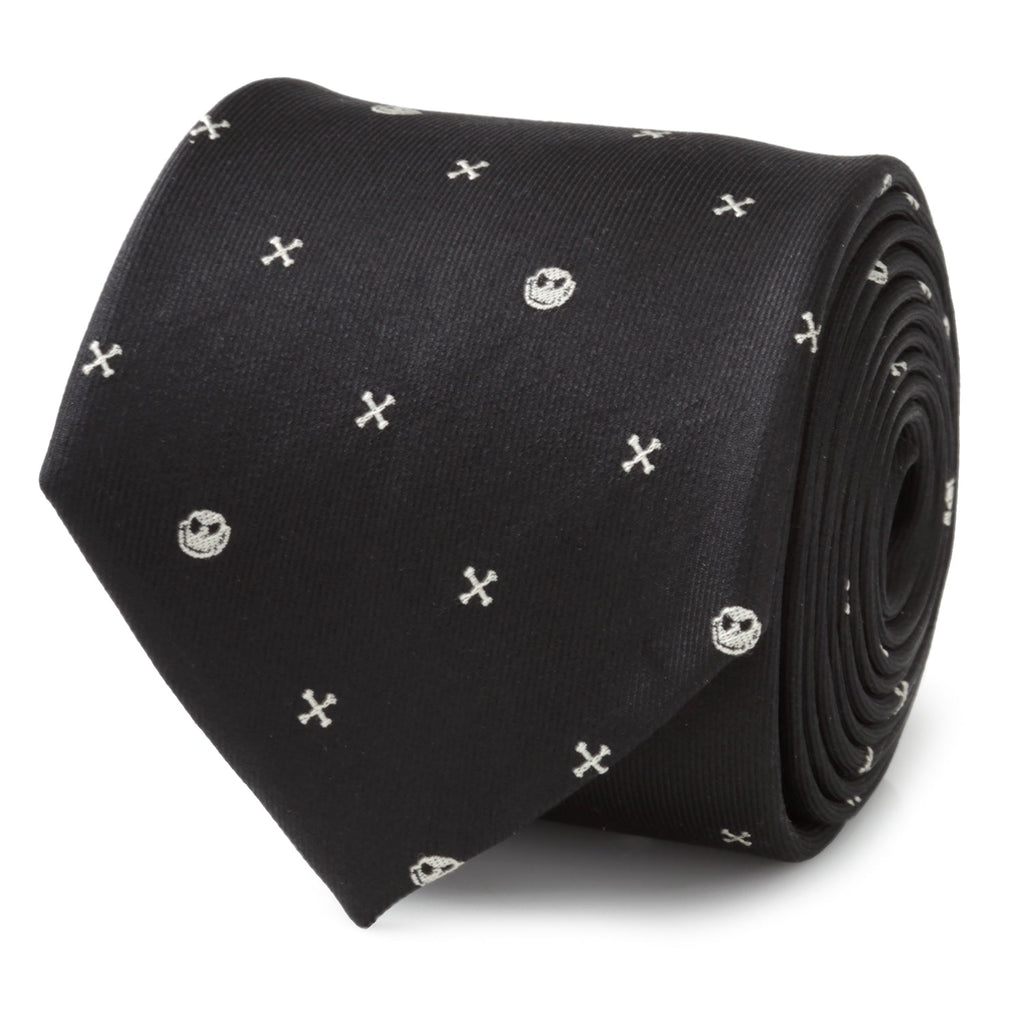 A black necktie featuring a repeating pattern of white Jack Skellington heads and small crossbones.