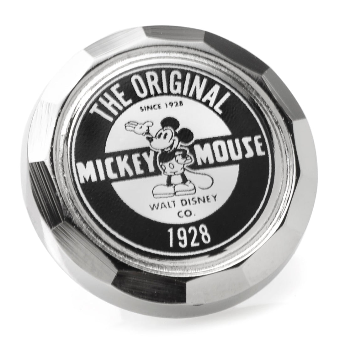 Close up of a round Disney Mickey Mouse lapel pin featuring 1928 vintage artwork and a silver finish.