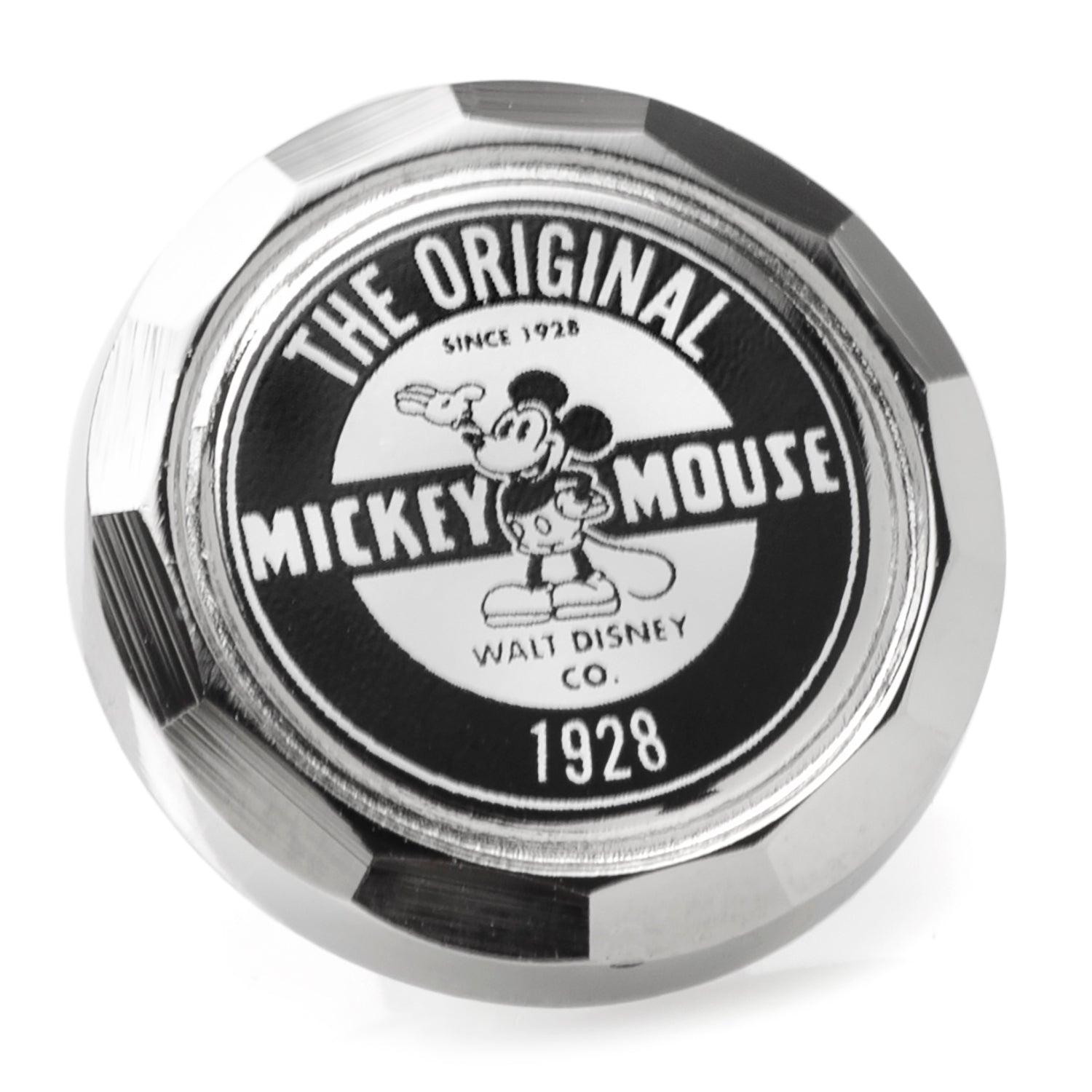 Close up of a round Disney Mickey Mouse lapel pin featuring 1928 vintage artwork and a silver finish.