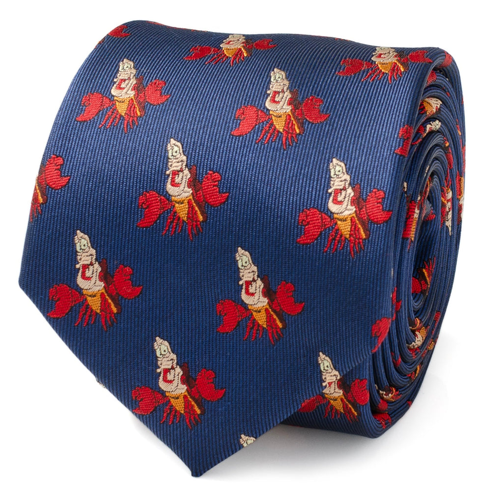Close up and full view of a blue necktie featuring a repeating pattern of Sebastian the crab from The Little Mermaid, with a hidden message reading Under The Sea on the back.