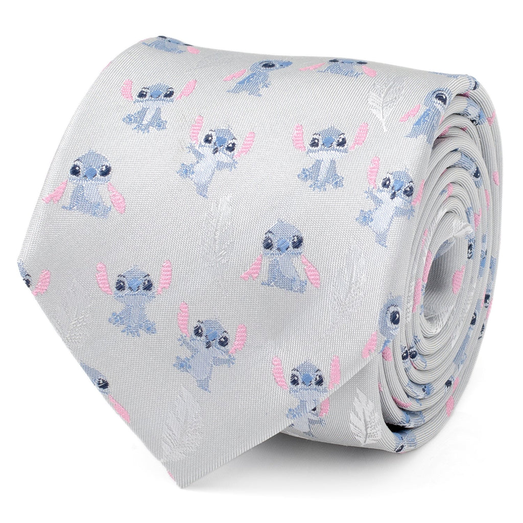 Close up of a gray necktie featuring a repeating pattern of Stitch from Lilo & Stitch and white feathers.