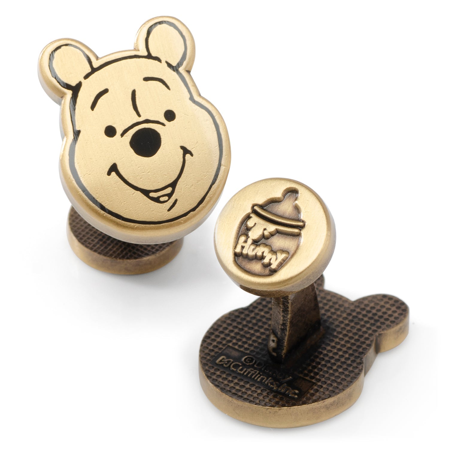 Close up of gold Winnie the Pooh face cufflinks with hunny pot design on the back