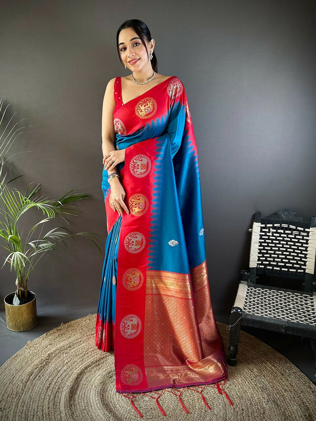 A beautiful red Banarasi soft silk saree with traditional butti pattern and unstitched blouse piece